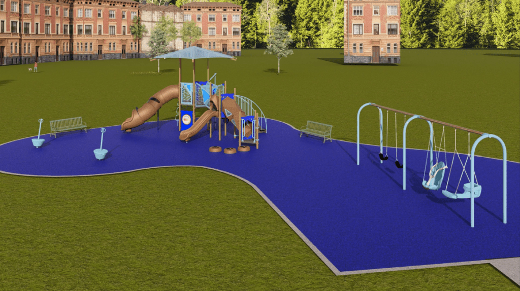 The image shows an outdoor playground built on a bright blue rubberized safety surface with an irregular curved edge. The playground is located in a large grassy field bordered by tall, dense green trees. Several multi‑story brick buildings are visible in the background.
In the center of the playground is a multi‑level play structure with several components. The structure includes two brown slides—one straight and one curved—extending from elevated platforms. A large square canopy supported by tall posts provides shade over the main structure. Access features include a staircase with handrails, a small arched ladder, and activity panels mounted along the sides. Several round stepping pods are arranged in front of one of the slides.
On the left side of the play area is a small spinning bowl seat on a pole, as well as a curved balancing or rocking structure. A green metal bench is placed behind these play elements.
On the right side of the playground is a swing set with light‑blue metal frames. The swing set includes two belt swings and two molded adaptive swings designed with high‑back seats and front supports. Another green metal bench sits behind the swing set.
The lighting suggests a sunny day with clear skies.