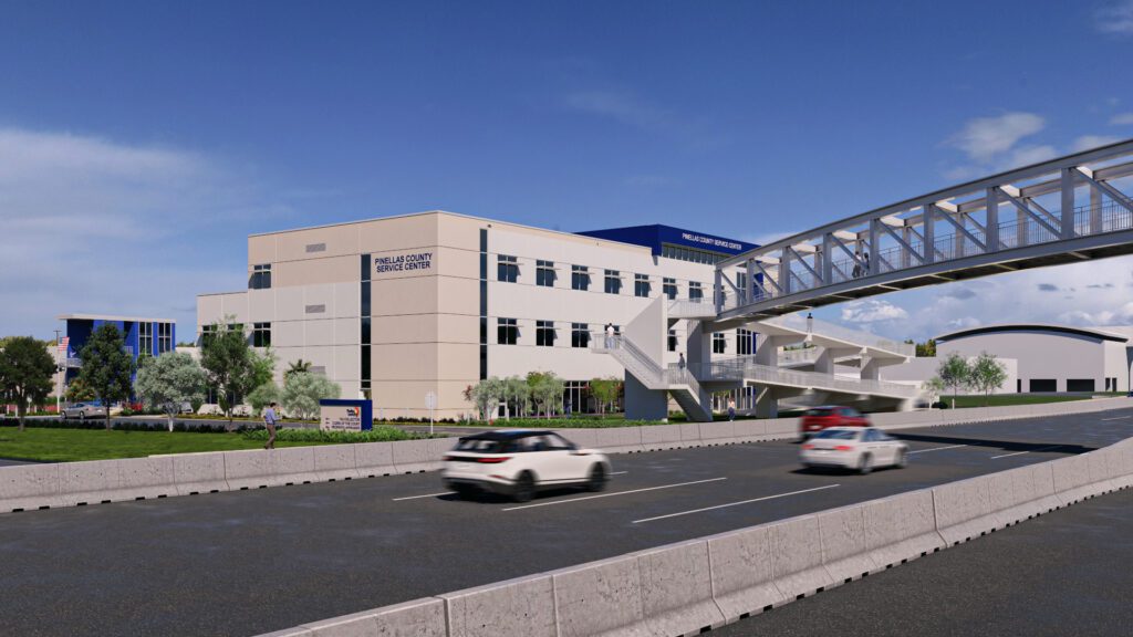 A rendering of the future North County Service Center from the east showing a three-story office building and a pedestrian bridge crossing Rt. 19.