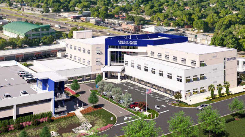 A rendering of the North County Service Center being built 2026-2028. the building is L shaped with three levels and a parking garage on the west side.