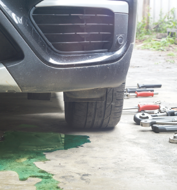Image depicting leaked antifreeze under a vehicle. 